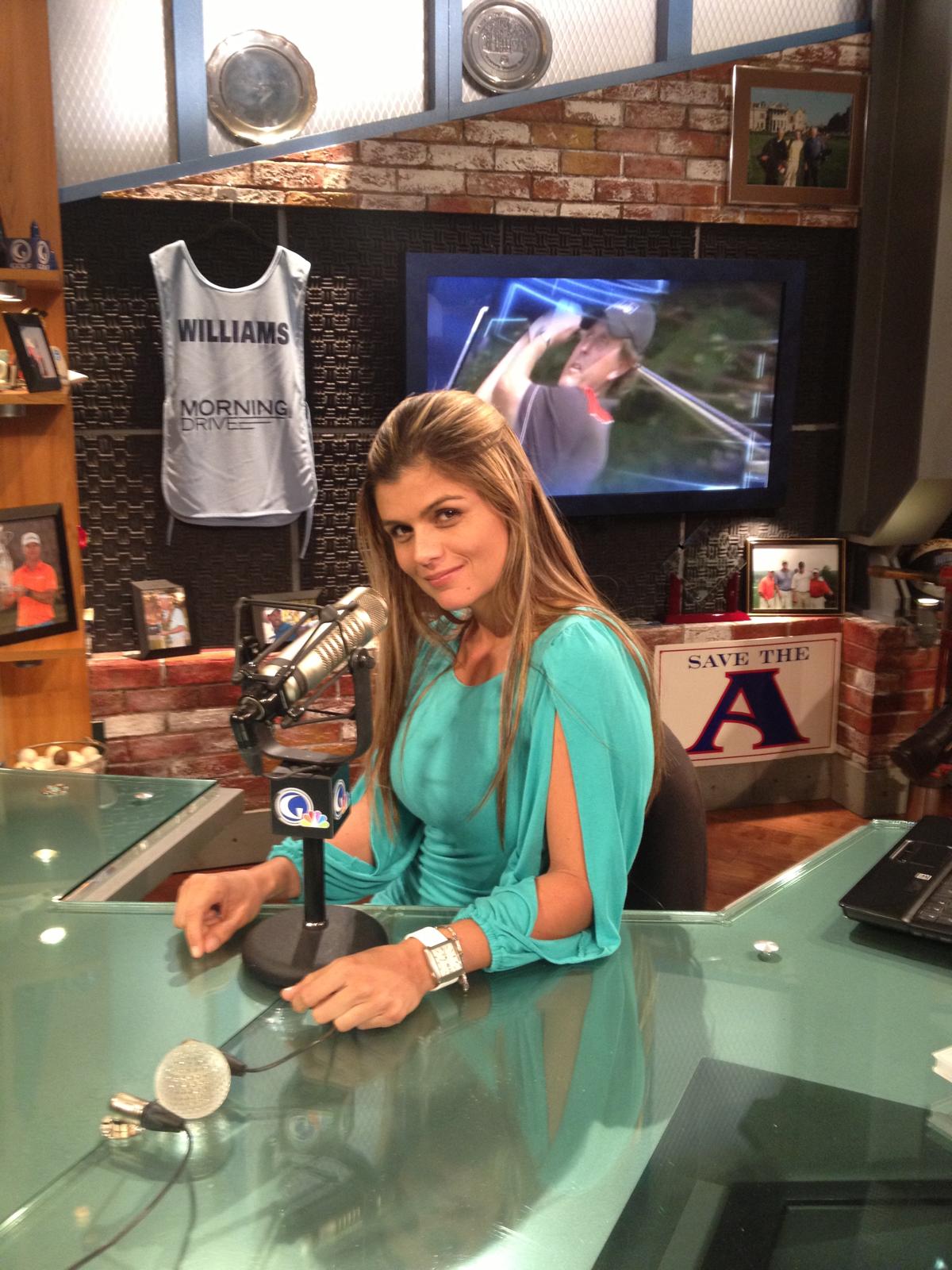 Valeria Brannen at a broadcast microphone in a golf studio